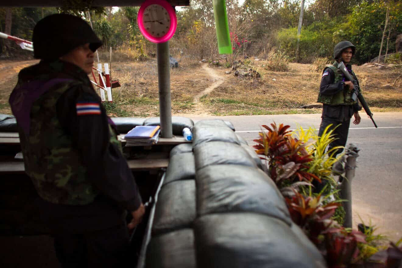 Thai soldiers at checkpoint the 11th-century Preah Vihear temple at the border between Thailand and Cambodia in Sisaket, Thailand, on Feb. 8, 2011. Photo by Athit Perawongmetha/Getty Images.