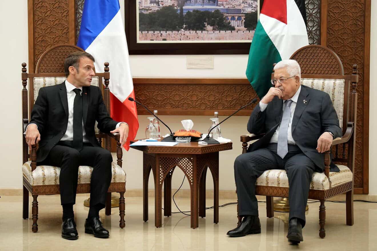 French President Emmanuel Macron (left) meets with Palestinian President Mahmoud Abbas in the West Bank city of Ramallah, on Oct. 24, 2023. Photo by Christophe Ena/POOL/AFP via Getty Images.