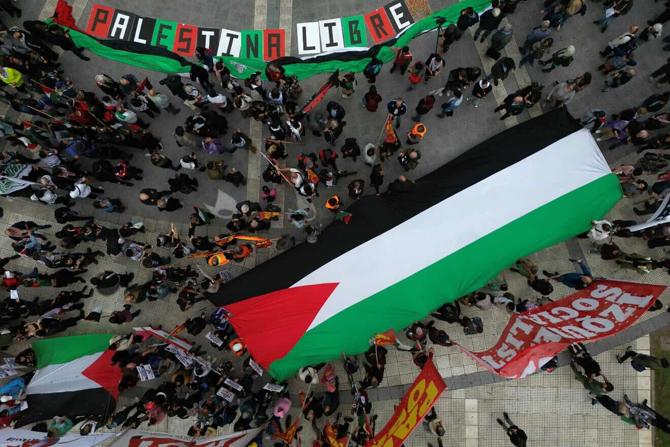 Demonstrators display a giant Palestinian flag during a pro-Palestinian protest within the framework of the first anniversary of the Israel-Hamas conflict at Plaza de Mayo Square in Buenos Aires, on Oct. 7, 2024. Photo by Juan Mabromata/AFP via Getty Images.