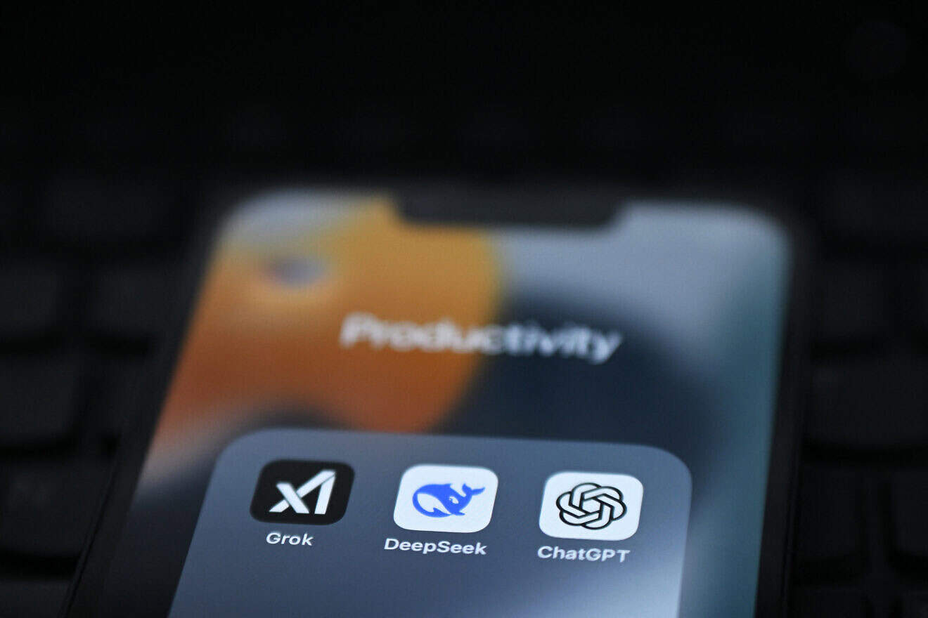 An illustration photograph taken on Feb. 20, 2025 shows Grok, DeepSeek and ChatGPT applications displayed on a phone screen. Photo by Justin Tallis/AFP via Getty Images.