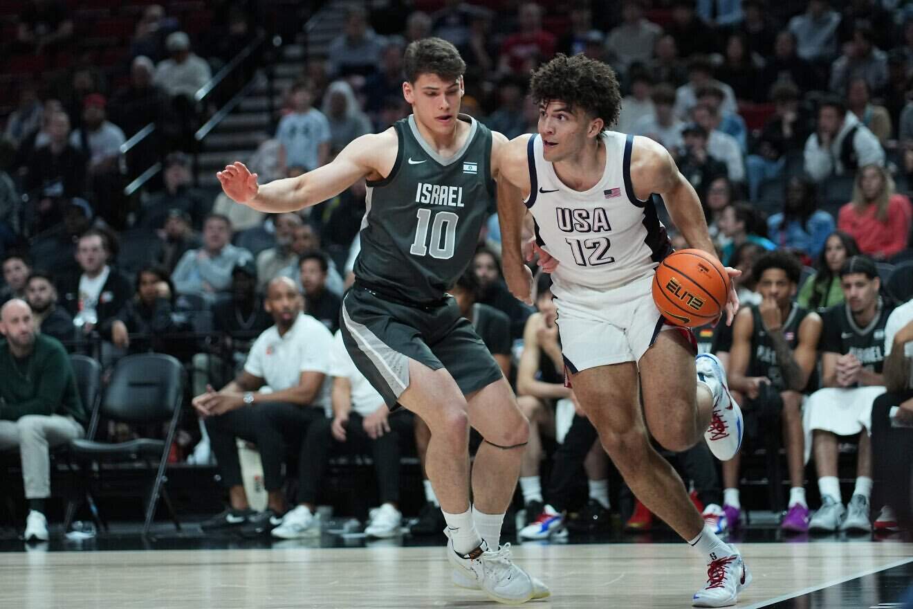 Cameron Boozer (No. 12) of Team USA dribbles against Omer Mayer (No. 10) of Team World during the 2025 Nike Hoop Summit at Moda Center in Portland, Ore., on April 12, 2025. Photo by Soobum Im/Getty Images.