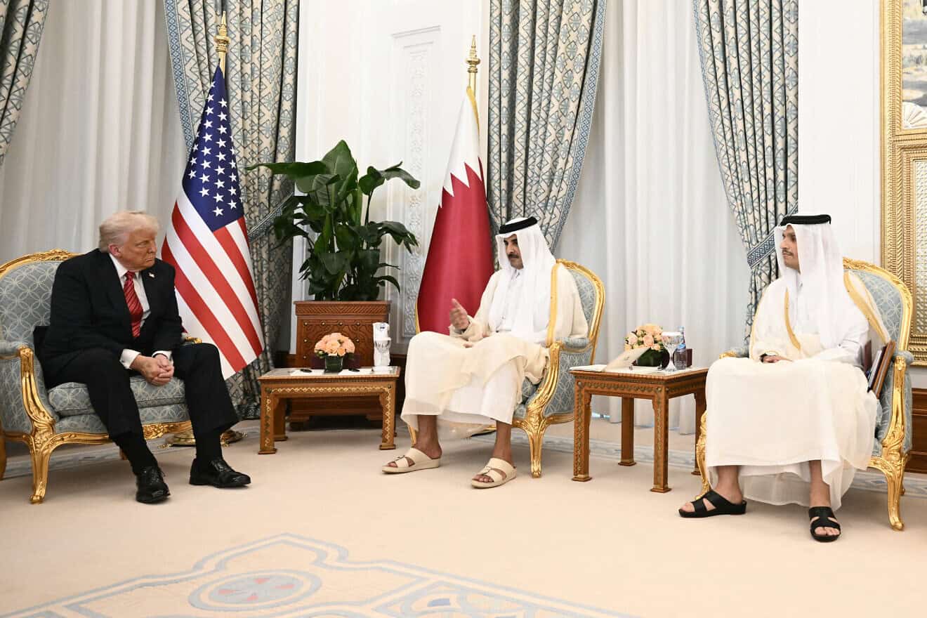 Qatar's Emir Sheikh Tamim bin Hamad al-Thani (C) receives US President Donald Trump (L), in the presence of Prime Minister and Minister of Foreign Affairs Sheikh Mohammed bin Abdulrahman Al-Thani, in Doha on May 14, 2025. Photo by Brendan Smialowski/AFP via Getty Images.