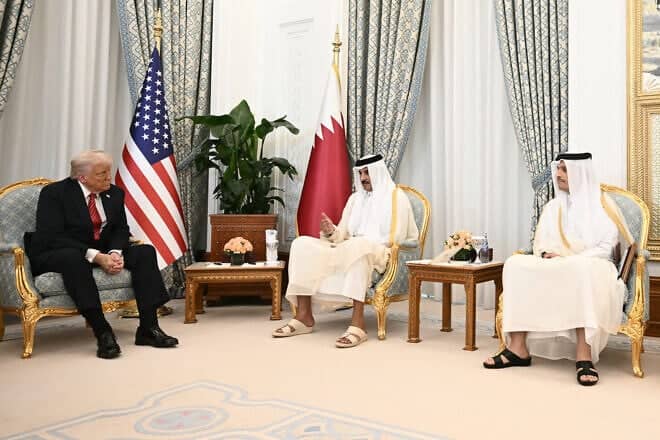 Qatar's Emir Sheikh Tamim bin Hamad al-Thani (C) receives US President Donald Trump (L), in the presence of Prime Minister and Minister of Foreign Affairs Sheikh Mohammed bin Abdulrahman Al-Thani, in Doha on May 14, 2025. Photo by Brendan Smialowski/AFP via Getty Images.