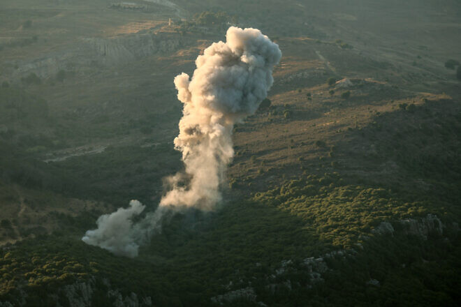 A plume of smoke rises above hills after an Israeli airstrike in the  Jezzine district of Southern Lebanon on June 20, 2025. Photo by Rabih Daher/AFP via Getty Images.