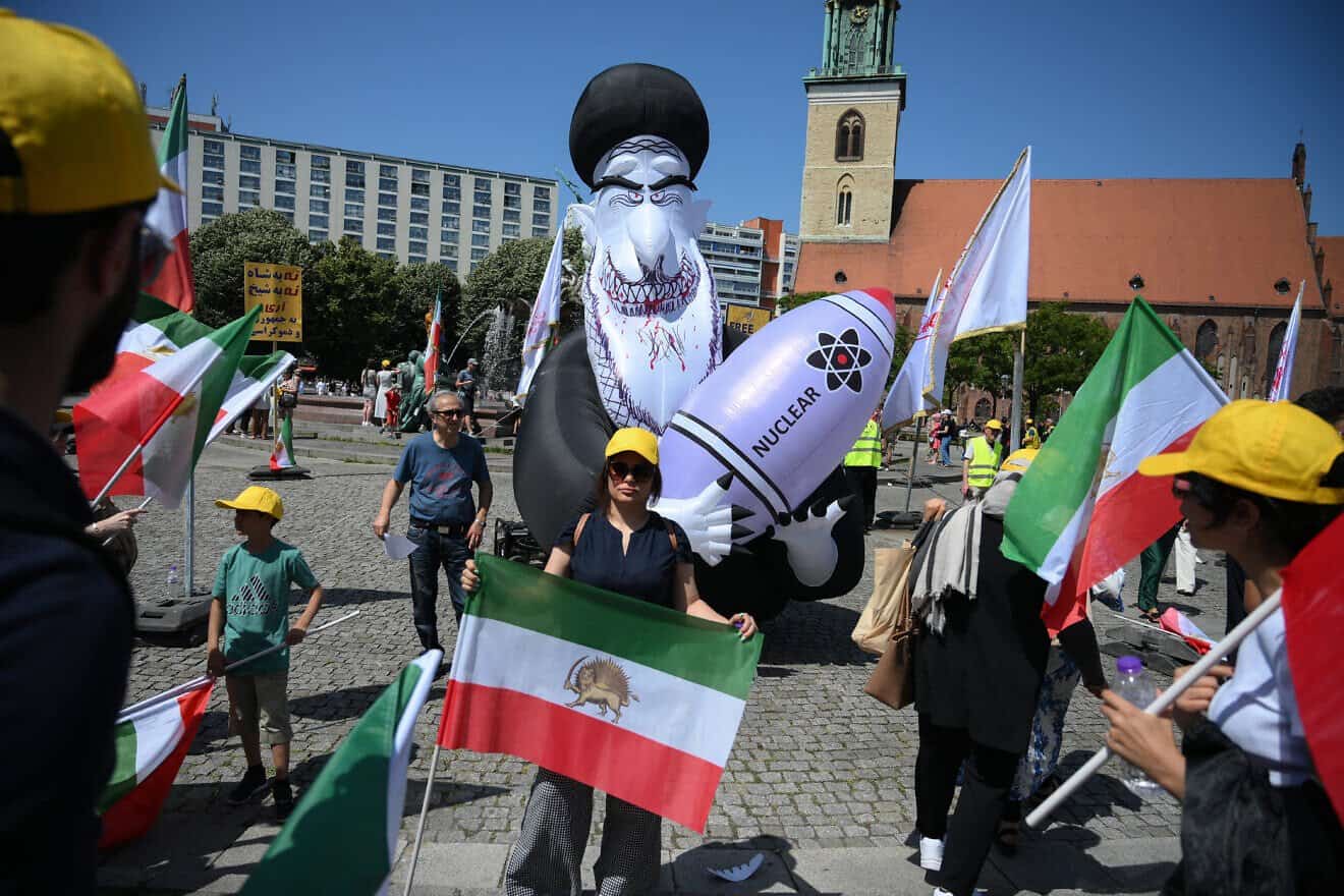 Protestors carry an inflatable effigy of Iran's Supreme Leader Ayatollah Ali Khamenei holding a nuclear bomb during a rally organized by the National Council of Resistance of Iran in front of the city hall in Berlin on June 21, 2025. Photo by Ralf Hirschberger/AFP via Getty Images.
