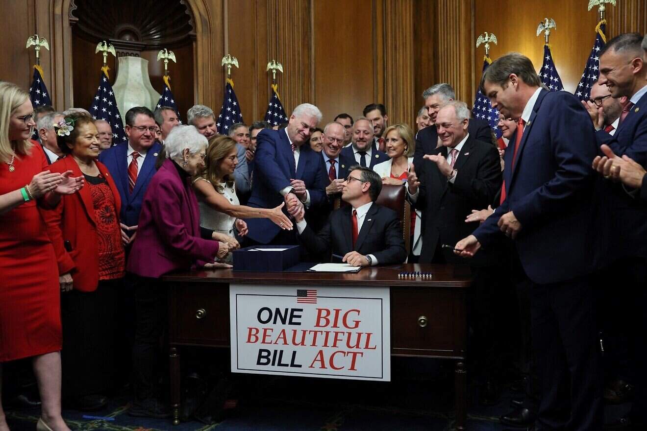 House Speaker Mike Johnson (R-La.) shakes hands with Rep. Tom Emmer (R-Minn.), House Majority Whip, before signing the "Big Beautiful Bill Act" after the House passed the legislation at the U.S. Capitol in Washington, D.C., July 3, 2025. Photo by Jemal Countess/AFP.