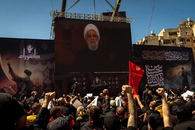 Lebanese terrorist supporters listen to a televised speech by Hezbollah chief Naim Qassem, July 6, 2025. Photo by Nael Chanine/Middle East Images/AFP via Getty Images.