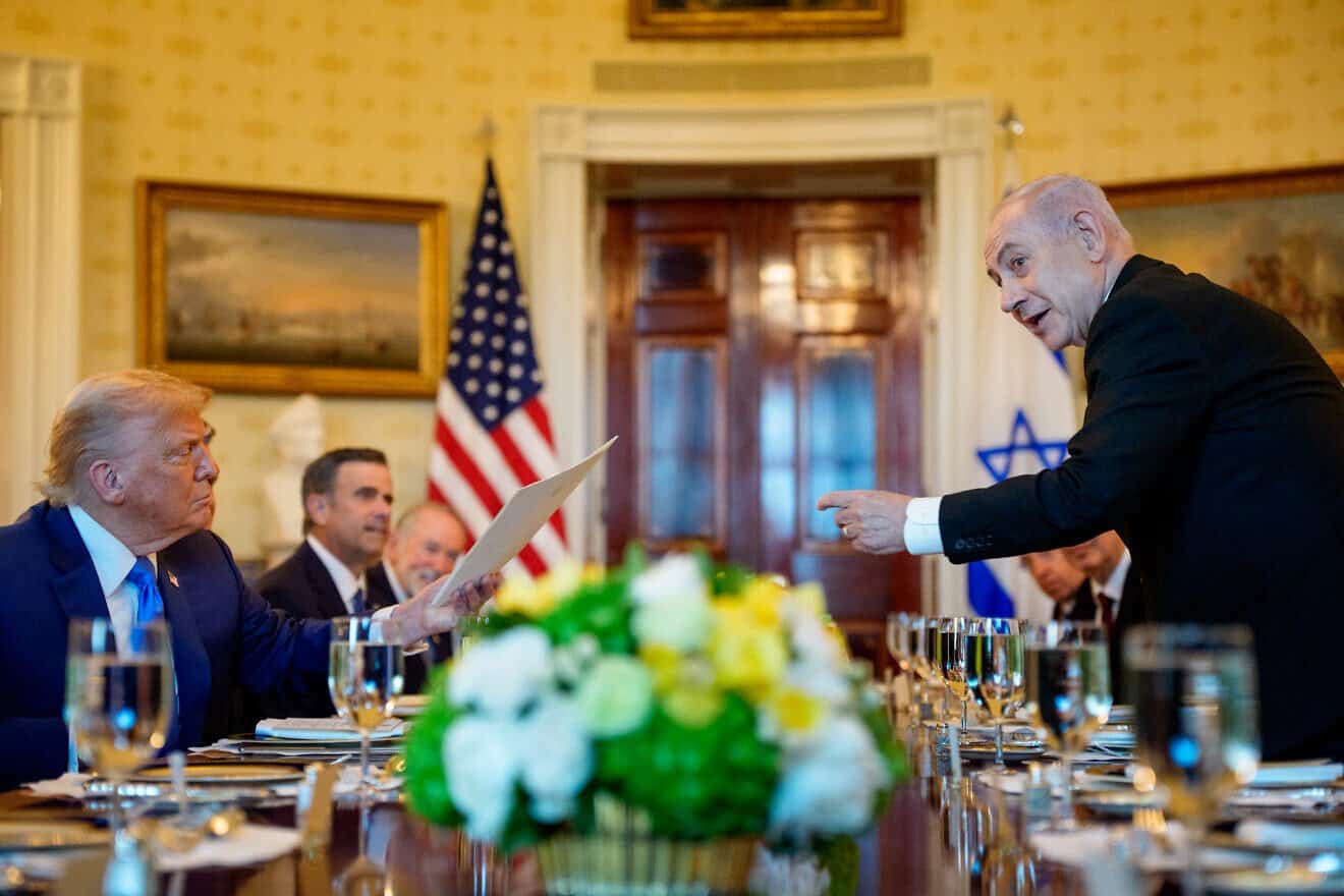 Israeli Prime Minister Benjamin Netanyahu hands off a letter he sent to the Nobel Peace Prize committee to nominate U.S. President Donald Trump for the Nobel Peace Prize during a dinner in the Blue Room of the White House in Washington, D.C., on July 7, 2025. Photo by Andrew Harnik/Getty Images.