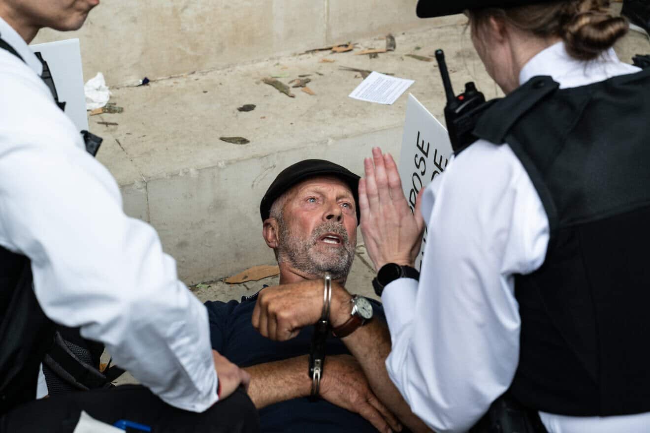 A supporter of Palestine Action is arrested in London during a protest after the United Kingdom banned the group under terrorism legislation. July 5, 2025. Photo by Guy Smallman/Getty Images.
