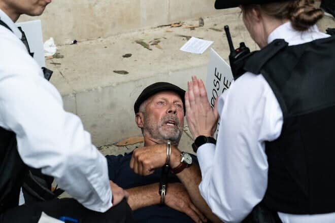 A supporter of Palestine Action is arrested in London during a protest after the United Kingdom banned the group under terrorism legislation. July 5, 2025. Photo by Guy Smallman/Getty Images.
