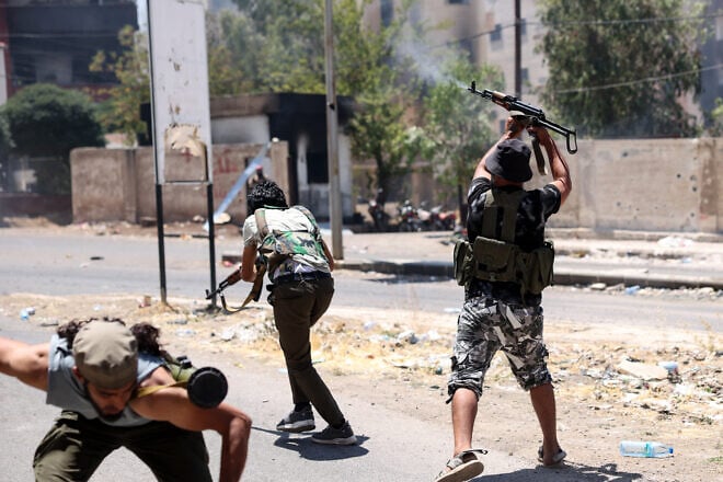 Bedouin tribal gunmen engage in combat with Druze fighters in Sweida city, in Syria's southern Sweida Province, on July 19, 2025. Photo by Bakr Alkasem/AFP via Getty Images.