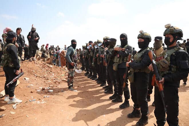 Syrian government security forces set up a checkpoint to prevent armed tribal fighters from advancing towards the town of Busra al-Hariri, east of the city of Sweida, on July 20, 2025. Photo by Omar Haj Kadour/AFP via Getty Images.