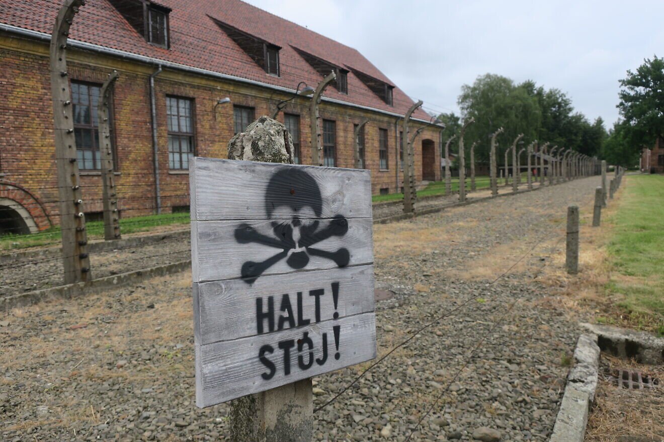 A warning sign at Auschwitz in 2018. Photo by Menachem Wecker.
