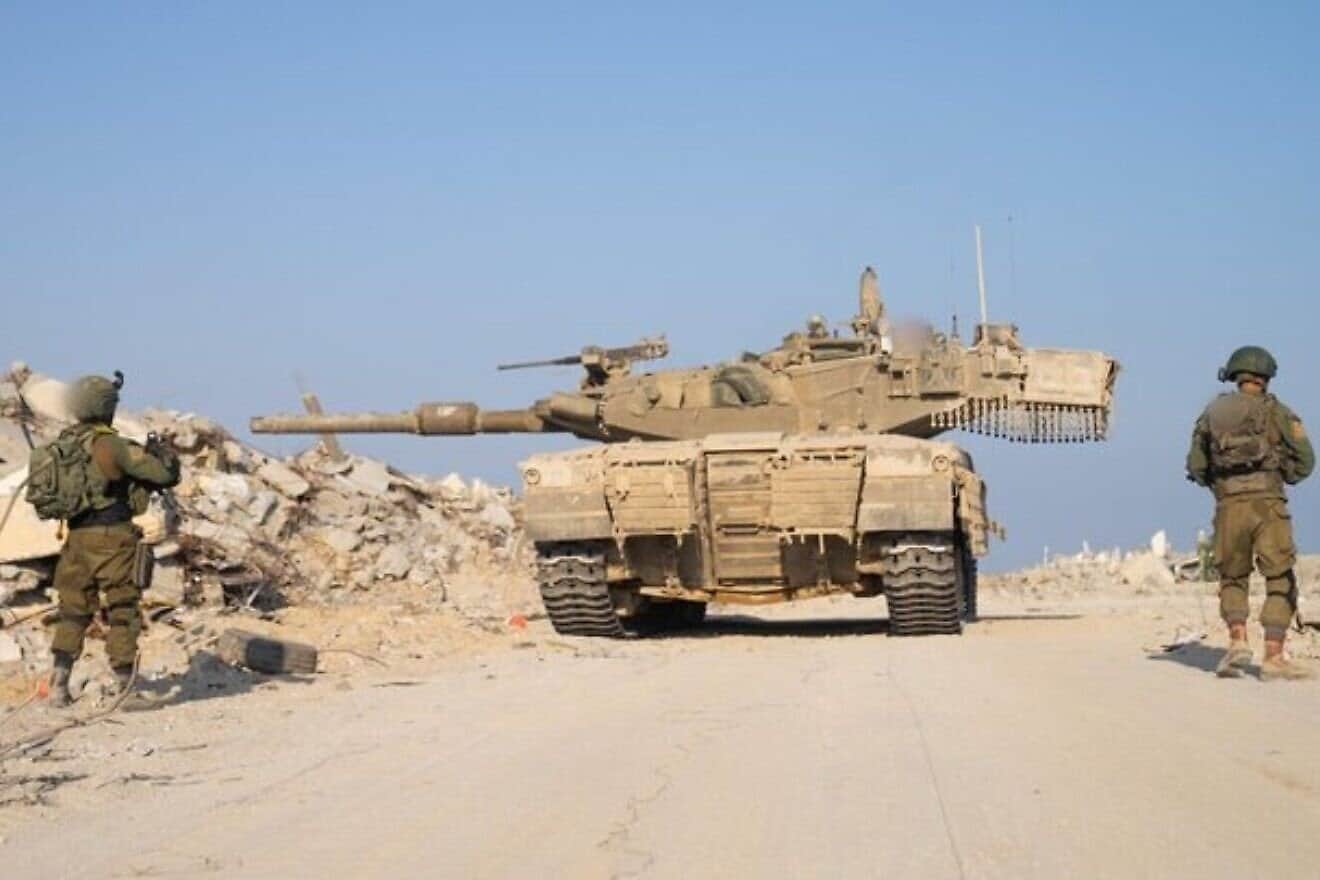 Israeli troops and a Merkava tank operating in the Gaza Strip. Credit: IDF.