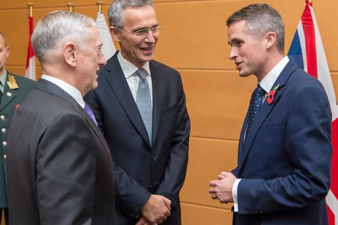 Then-British Defense Minister Gavin Williamson (right) meets with U.S. Secretary of Defense Jim Mattis (left) and NATO Secretary-General Jens Stoltenberg in Brussels in November 2017. Photo by U.S. Air Force Staff Sgt. Jette Carr/DOD via Wikimedia Commons.