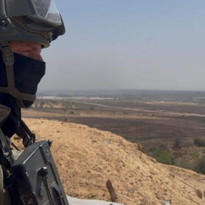 Lt. Col. T., commander of the IDF's 969th Battalion, stands in the northern Gaza Strip and looks down on Beit Hanoun and Kibbutz Kibbutz Kfar Aza, July 17, 2025. Credit: ILTV.
