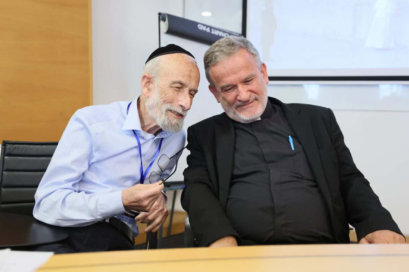 Rabbi Daniel Epstein of the Matan Institute speaks with Fr. David Neuhaus of the Pontifical Biblical Institute in Jerusalem at the Open University of Israel conference in Ra’anana titled “Nostra Aetate—The Declaration and Its Legacy: 60 Years of Jewish-Christian Dialogue,” June 11-12, 2025. Credit: Yam Lavi/Open University.
