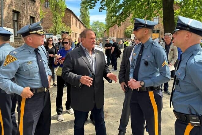 From left: Col. Patrick Callahan, superintendent of the New Jersey State Police; Paul Goldenberg; Sgt. Mudduser Malik, president of the Muslim Troopers Association; and Lt. Marc Zislin, president of Jewish Troopers Association at the grounds of Auschwitz for the March of the Living, May 6, 2024. Photo by Mark Genatempo.