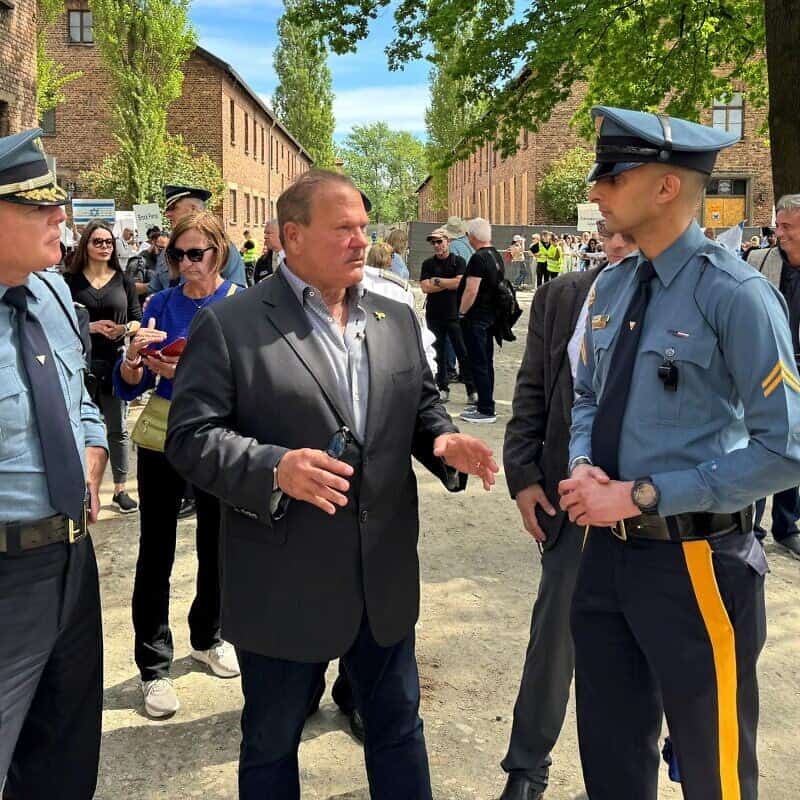 From left: Col. Patrick Callahan, superintendent of the New Jersey State Police; Paul Goldenberg; Sgt. Mudduser Malik, president of the Muslim Troopers Association; and Lt. Marc Zislin, president of Jewish Troopers Association at the grounds of Auschwitz for the March of the Living, May 6, 2024. Photo by Mark Genatempo.