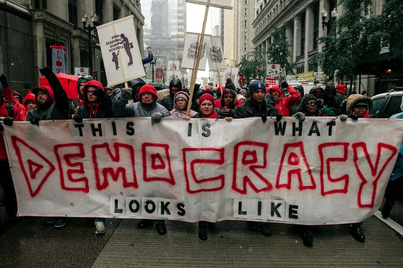 Thousands march through the streets near City Hall in Chicago during the 11th day of an ongoing teachers strike on Oct. 31, 2019.  Photo by Scott Heins/Getty Images.