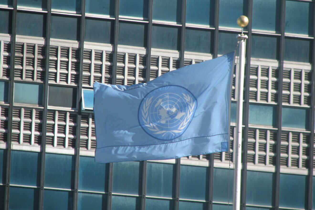 Flag of the United Nations outside the U.N. headquarters in New York City. Credit: U.S. Agency for International Development via Wikimedia Commons.