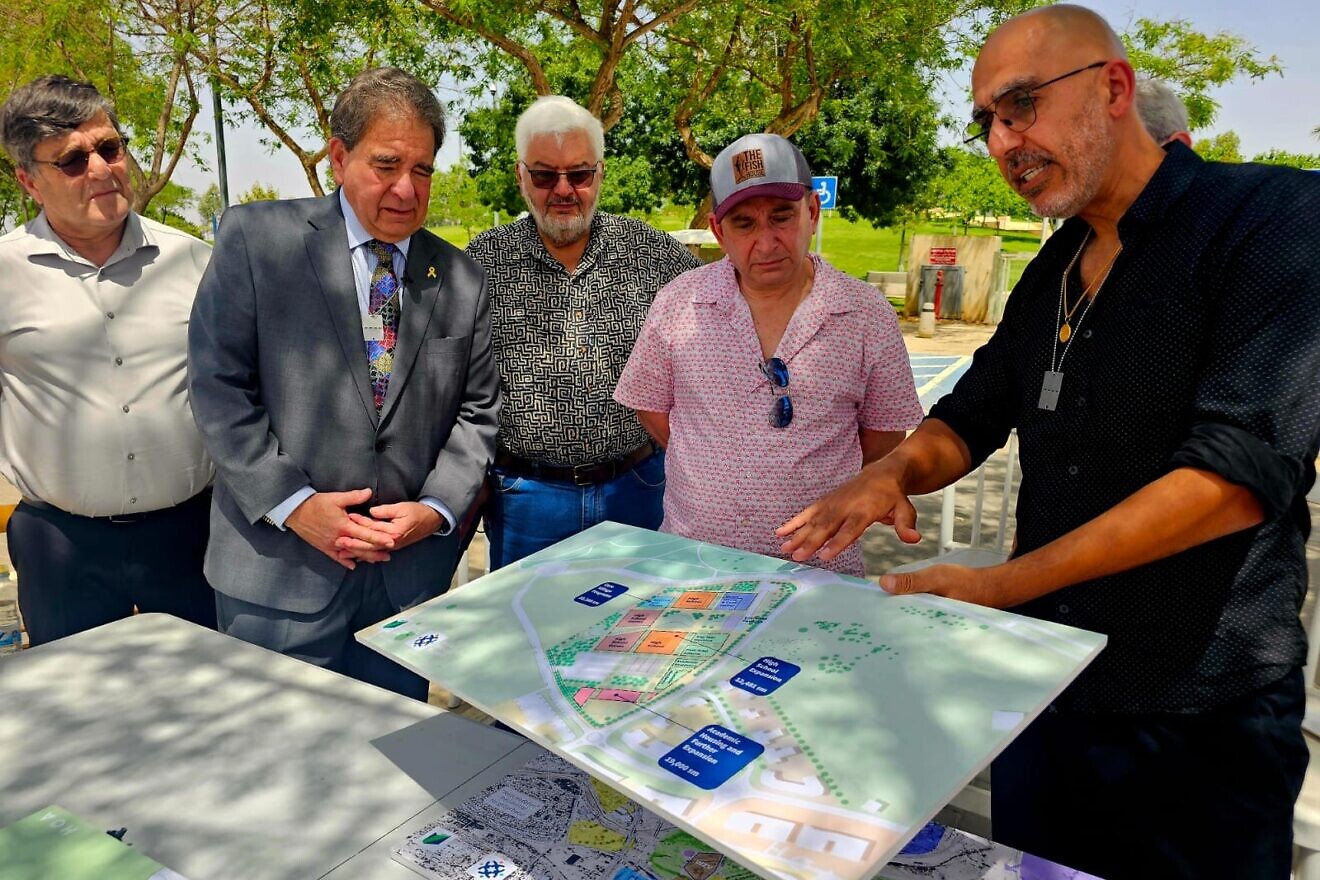 Reviewing plans for the World Zionist Village are, from left, the village’s international development director Boaz Meir; Jewish National Fund-USA CEO Russell F. Robinson; Jewish National Fund-USA’s vice president of outreach Bob Lembke; and Todd Patkin. Credit: Courtesy of Jewish National Fund-USA.