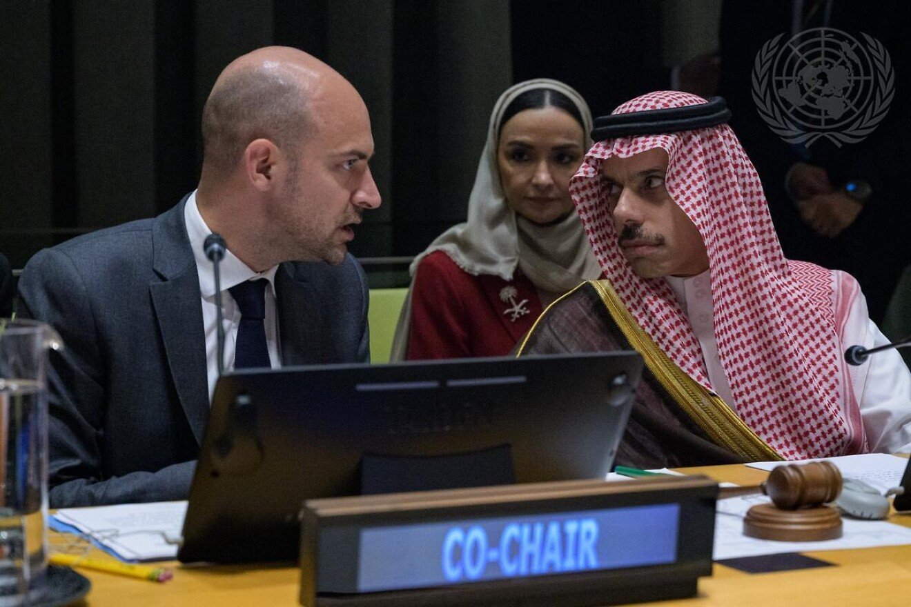 Co-chairs of a United Nations meeting on a two-state solution, Jean-Noël Barrot (left), French foreign minister, and Prince Faisal bin Farhan Al-Saud, Saudi foreign minister, talk during the session, July 28, 2025. Credit: Manuel Elías/U.N. Photo.