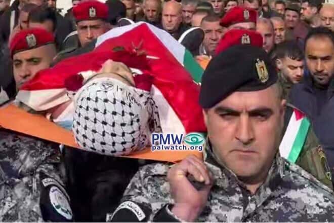 The funeral of one of the terrorists who was a PASF officer, adorned with a headband of Al Aqsa Martyrs Brigades. Credit: Palestinian Media Watch.