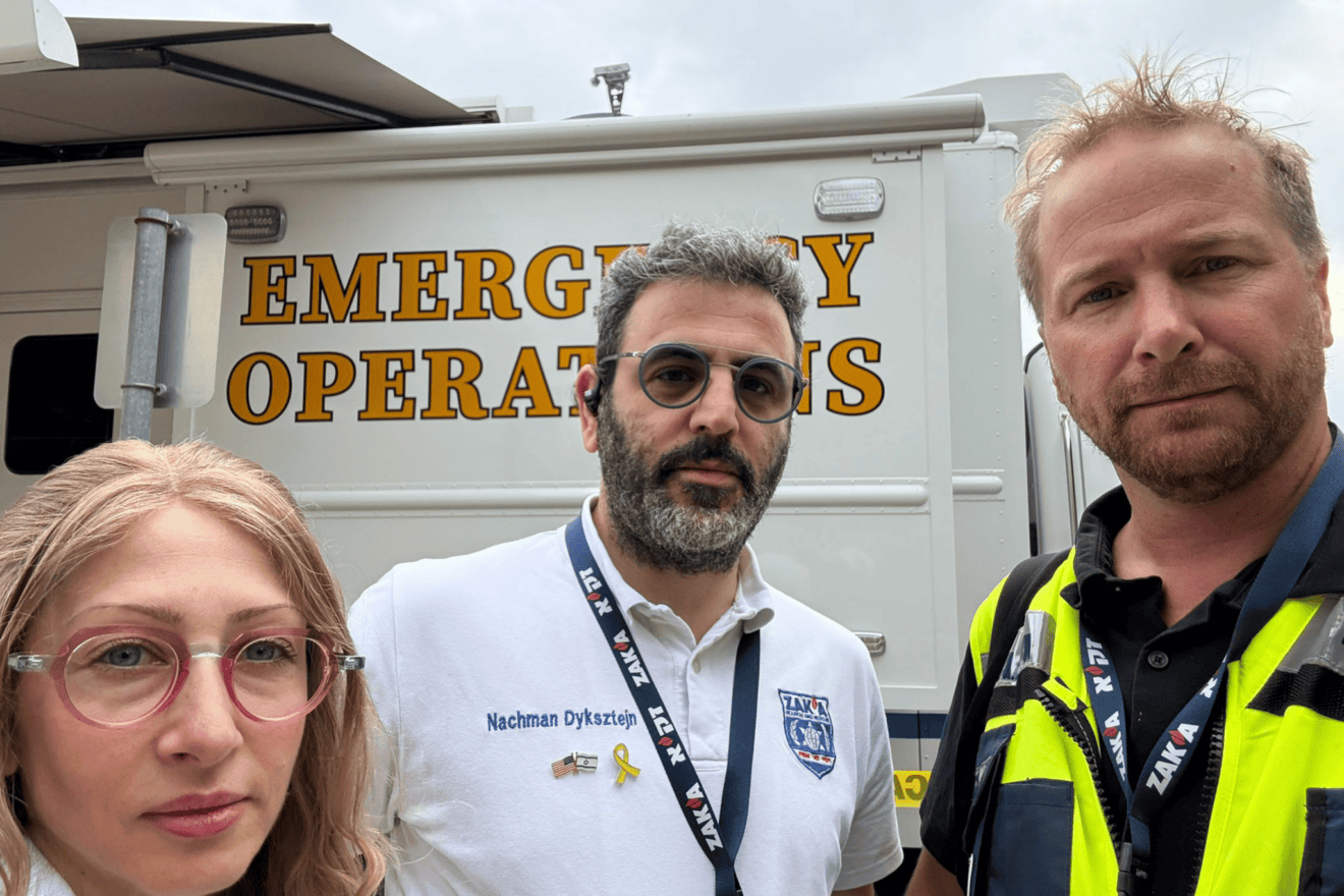 ZAKA international commander Nachman Dyksztejn (center) worked in close coordination with members of the Texas A&M Task Force 1 and under the supervision of the Texas Division of Emergency Management, July 2025. Credit: Courtesy of ZAKA.