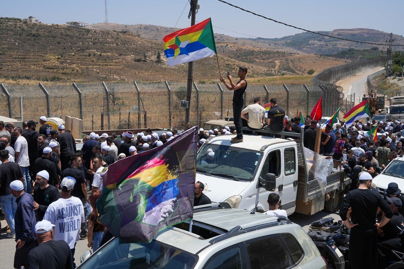 Druze residents protest near the Israeli-Syrian border fence in solidarity with their community in Syria, in Majdal Shams, July 16, 2025. Photo by Ayal Margolin/Flash90.