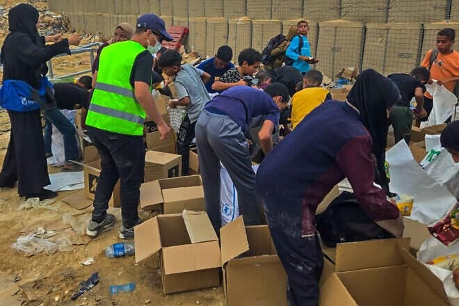 Palestinians receiving aid from the Gaza Humanitarian Foundation in Gaza, June 2025. Credit: GHF.