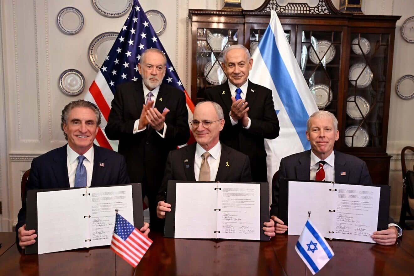 Front row, left to right: U.S. Energy Secretary Doug Burgum, Israeli Ambassador to the U.S. Yechiel Leiter and U.S. Interior Secretary Chris Wright. Standing, second row, left to right: U.S. Ambassador to Israel Mike Huckabee and Israeli Prime Minister Benjamin Netanyahu. The signing ceremony for cooperation on artificial intelligence and energy took place at Blair House in Washington, D.C., on July 8, 2025. Photo by Avi Ohayon/GPO.