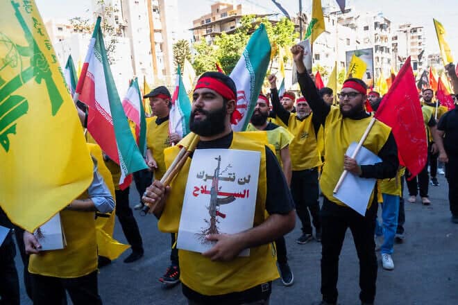 Shia Muslim worshipers gather with Hezbollah flags in the southern suburbs of Beirut, Lebanon on July 6, 2025. Photo by Nael Chahine/Middle East Images/AFP via Getty Images.