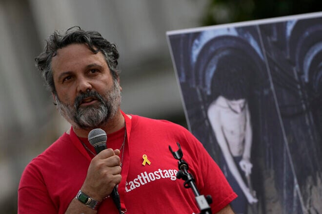 Adam Ma'anit, cousin of slain hostage Tsachi Idan, speaks to the crowd after attending a "National March for the Hostages" organized by Stop the Hate UK, in central London on Aug. 10, 2025. Photo by Carlos Jasso/AFP via Getty Images.