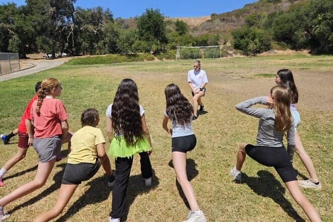 Warming up for the Maccabiah Camp Experience soccer seminar with Sydney Slotkin, July 2025. Credit: Courtesy.