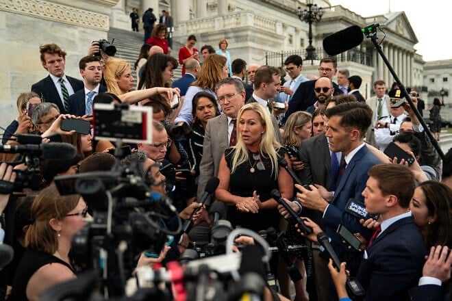 Rep. Marjorie Taylor Greene (R-Ga.), and Rep. Thomas Massie (R-Ky.), speak to members of the press on the steps of the U.S. House of Representatives at the Capitol building in Washington, D.C., on May 8, 2024. Photo by Kent Nishimura/Getty Images.