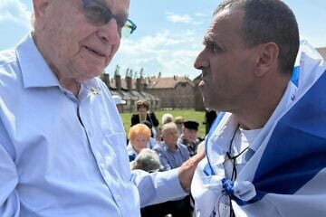 Holocaust survivor Naftali Fürst and freed hostage Eli Sharabi in Auschwitz, April 2025. Credit: MOTL.
