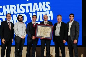 Israeli Ambassador to the United States Yechiel Leiter is presented an award by Passages for his contribution to U.S.-Israel relations. From left: Will Davis, Passages board member; Harry Cohen, Passages board member; John Coleman, Passages board member; Leiter; Steve Green, president of Hobby Lobby and board chairman of the Museum of the Bible; and Zach Bauer, CEO of Passages. Photo by Cade Chudy.