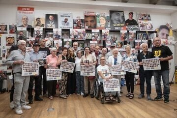 Holocaust survivors pose for a photograph after meeting released hostages families of hostages still being held in Gaza, in Tel Aviv on August 5, 2025. Photo by Chen Schimmel. 