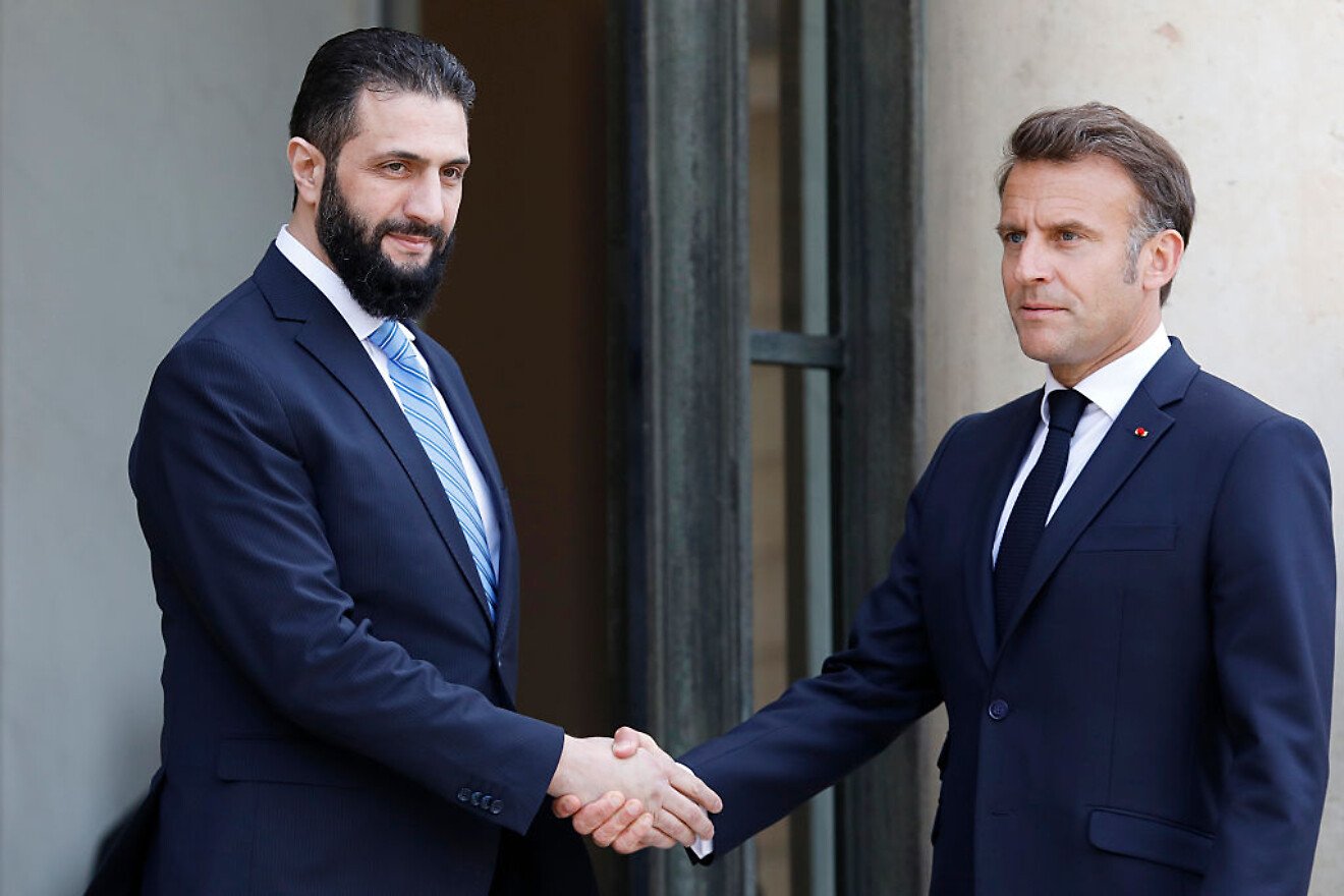 French President Emmanuel Macron welcomes Syrian President Ahmed al-Sharaa at the Elysée Palace in Paris on May 07, 2025. Photo by Antoine Gyori/Corbis/Getty Images.
