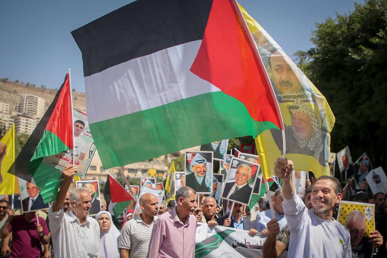 Palestinians celebrate and wave flags and pictures of the late PLO chief Yasser Arafat and the current leader of the Palestinian Authority, Mahmoud Abbas, during a rally in Nablus after French President Emmanuel Macron recognized the state of Palestine at the United Nations, Sept. 23, 2025. Photo by Nasser Ishtayeh/Flash90. Palestinians celebrate and wave flags and pictures of the late PLO chief Yasser Arafat and the current leader of the Palestinian Authority, Mahmoud Abbas, during a rally in Nablus after French President Emmanuel Macron recognized the state of Palestine at the United Nations, Sept. 23, 2025. Photo by Nasser Ishtayeh/Flash90.