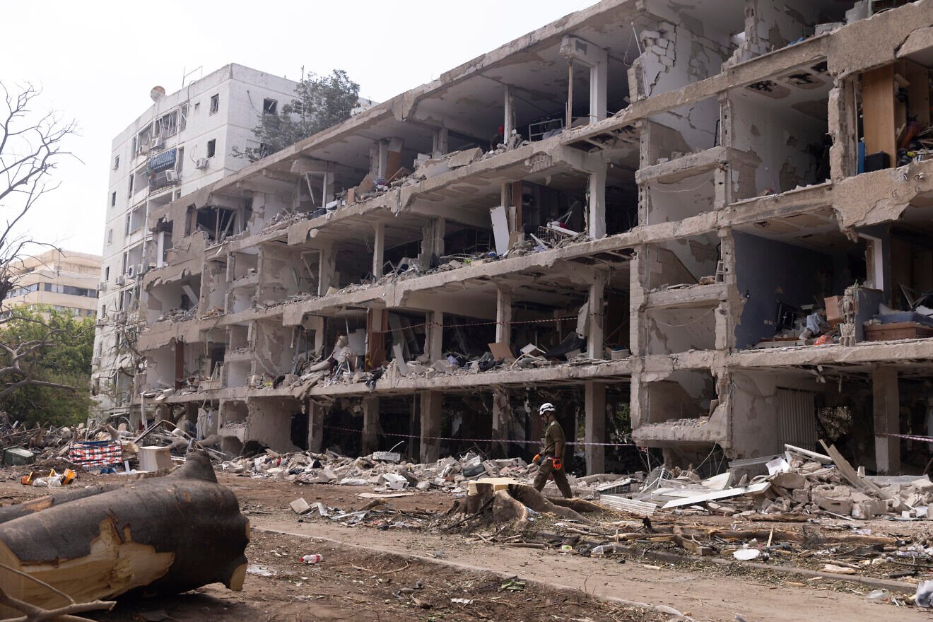 An IDF Home Command soldier walks through rubble a day after an Iranian ballistic missile hit in Tel Aviv, June 23, 2025. Photo by Amir Levy/Getty Images.