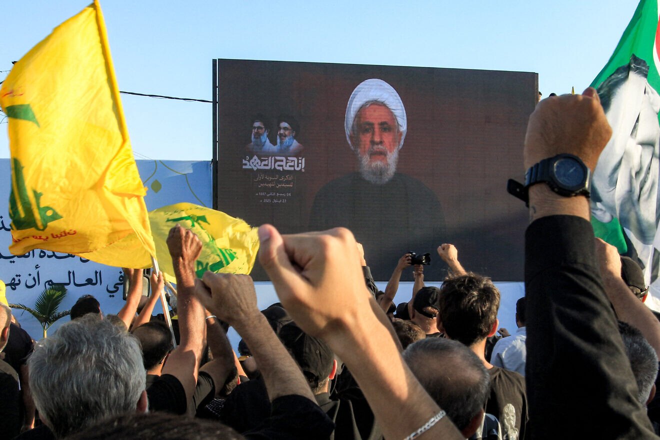 Hezbollah leader Naim Qassem addresses mourners via video during a ceremony in Deir Qanoun al-Nahr, near Tyre in Southern Lebanon, on the first anniversary of Israel's assassination of the group's longtime leader Hassan Nasrallah and other group leaders, Sept. 27, 2025. Photo by Mahmoud Zayyat/AFP via Getty Images.