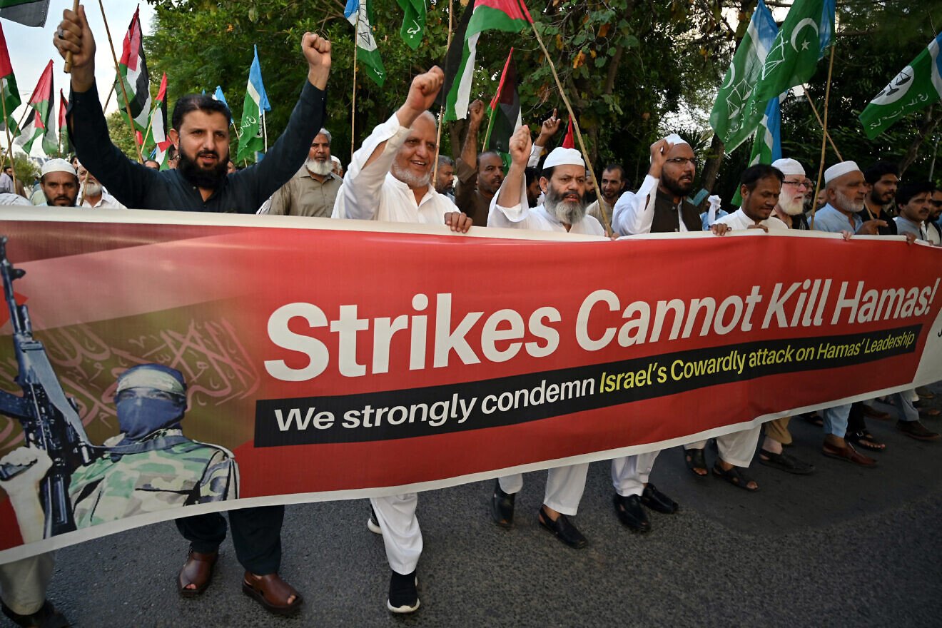 Protesters associated with Pakistan's Jamaat-e-Islami (JI) Party in Islamabad hold a banner against Israel's airstrikes targeting Hamas leaders in Qatar, Sept. 10, 2025. Photo by Farooq Naeem/AFP via Getty Images.
