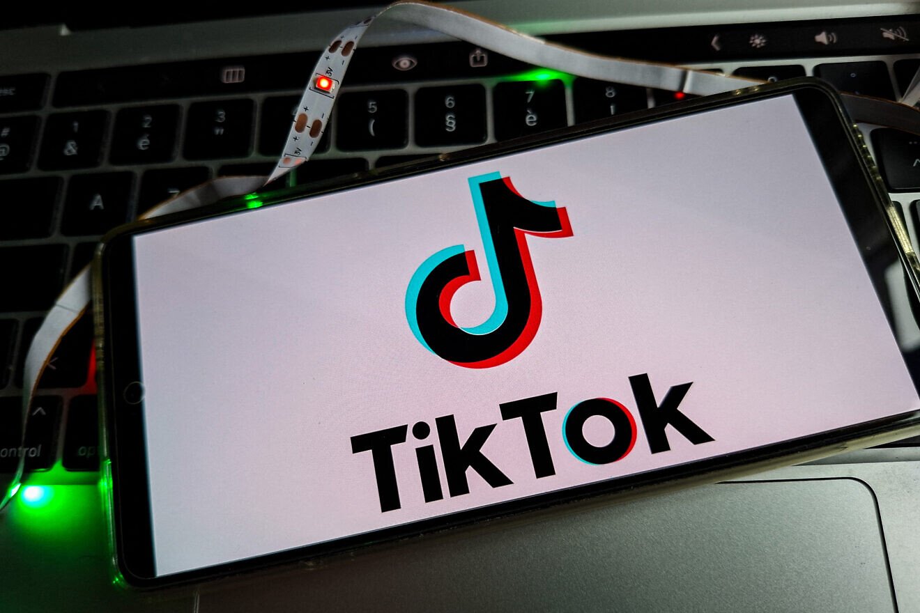 Illustration of TikTok, a mobile application for sharing short creative videos and images as well as a social network based on a recommendation algorithm favoring virality, Oct. 16, 2025. Photo by Riccardo Milani/ Hans Lucas/AFP via Getty Images.