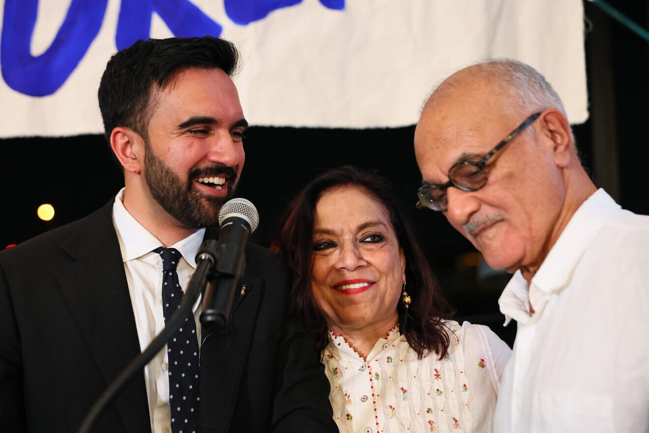 New York state assemblyman Rep. Zohran Mamdani with his mother, Indian-American Mira Nair, and his father, professor Mahmood Mamdani, as they celebrate his primary win for the Democratic candidate for mayor of New York City at an election night gathering at the Greats of Craft LIC in Long Island City, Queens, on June 24, 2025. Photo by Michael M. Santiago/Getty Images.