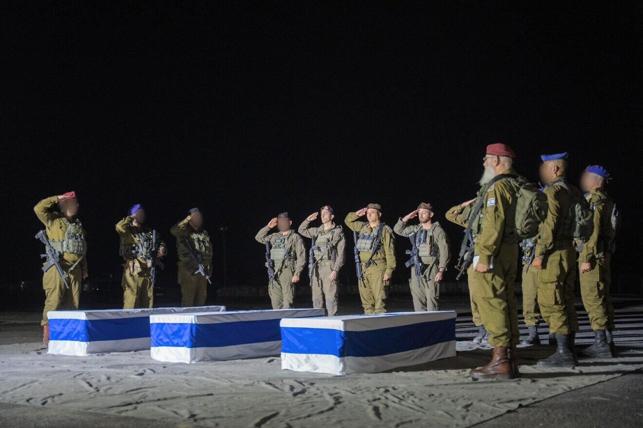 Three coffins draped in Israeli flags are surrounded by IDF soldiers standing at attention, paying tribute to the fallen hostages during a solemn ceremony in Israel on Nov. 2, 2025. Credit: IDF. Three coffins draped in Israeli flags are surrounded by IDF soldiers standing at attention, paying tribute to the fallen hostages during a solemn ceremony in Israel on Nov. 2, 2025. Credit: IDF.
