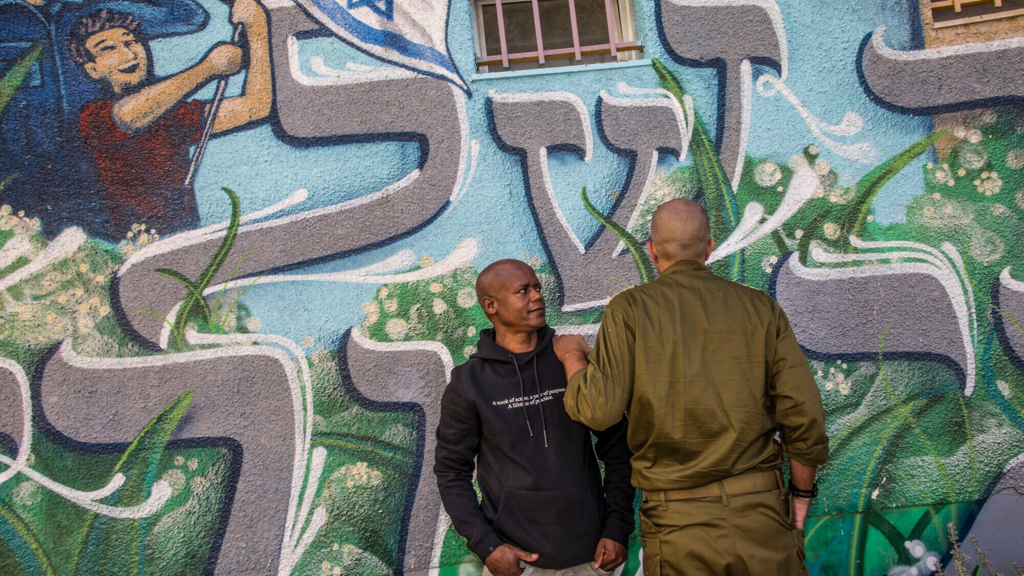 Eritrean migrant Mulugeta Taegay and the Israeli officer he saved during the Hamas-led terrorist attacks in southern Israel on Oct. 7, 2023, see together again on Nov. 13, 20205. Photo by Rina Castelnuovo.
