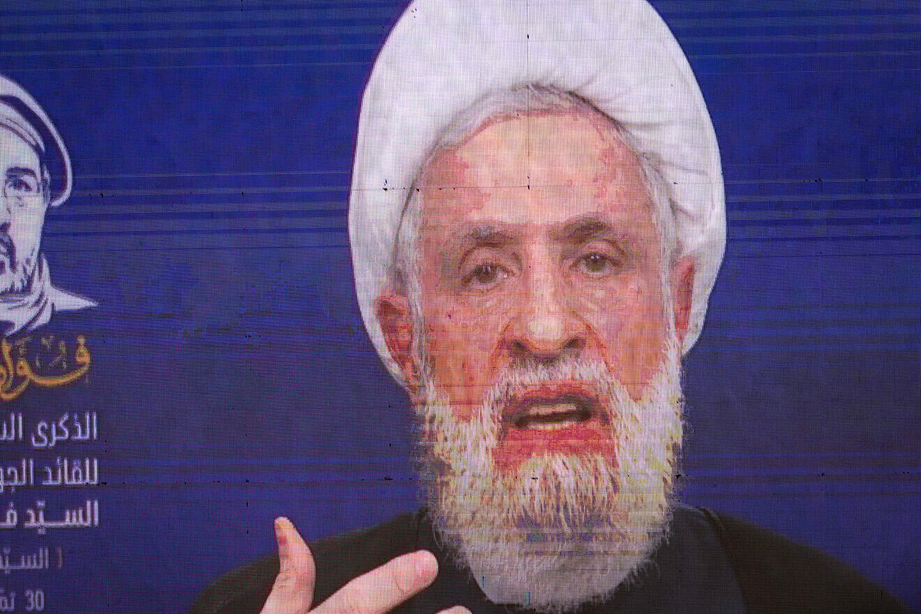 Hezbollah leader Naim Qassem delivers a televised speech at a ceremony commemorating the first anniversary of the death of Fuad Shukr, a founding member and commander of Hezbollah's armed wing who was killed in an Israeli airstrike in Beirut for his involvement in the Majdal Shams attack, in Hadath, Lebanon, on July 30, 2025. Photo by Daniel Carde/Getty Images. Hezbollah leader Naim Qassem delivers a televised speech at a ceremony commemorating the first anniversary of the death of Fuad Shukr, a founding member and commander of Hezbollah's armed wing who was killed in an Israeli airstrike in Beirut for his involvement in the Majdal Shams attack, in Hadath, Lebanon, on July 30, 2025. Photo by Daniel Carde/Getty Images.