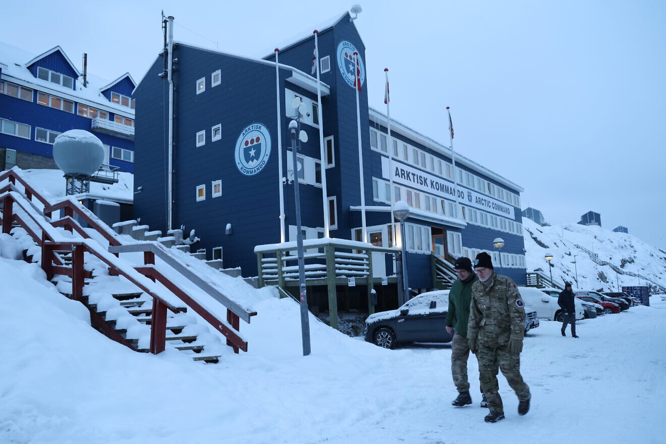 Danish military personnel walk past a building of the Danish Arctic Command in Nuuk, Greenland, on Jan. 19, 2026 European leaders are scheduled to meet later this week to formulate their response to U.S. President Donald Trump's recent threat of punitive tariffs against countries who obstruct the U.S. goal of acquiring Greenland.  Photo by Sean Gallup/Getty Images.